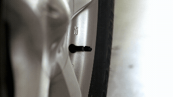 Animated GIF of checking tire pressure with a gauge