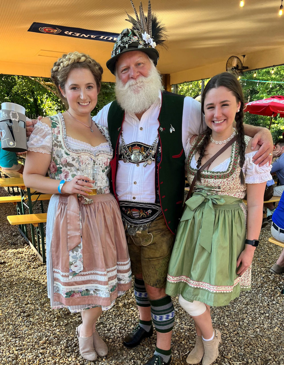 Attendees wear traditional German clothes and accessories