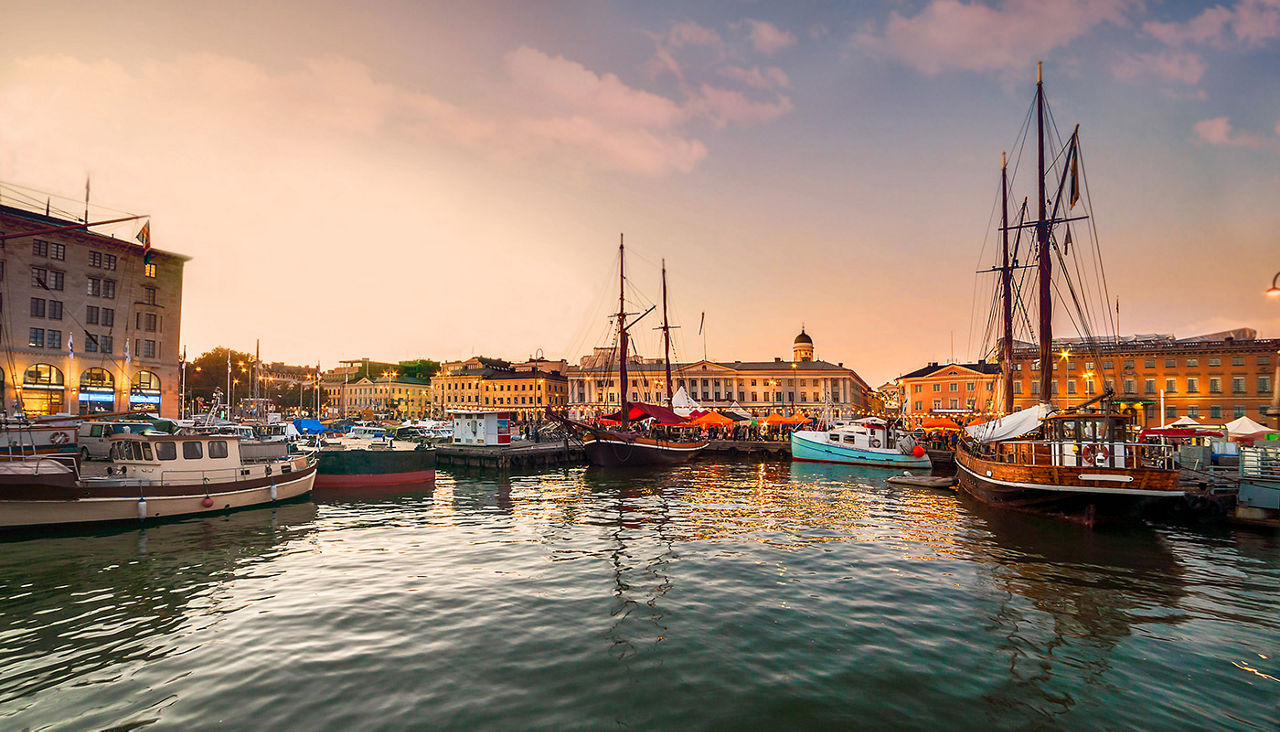 Port with boats docked in Helsinki at sunset