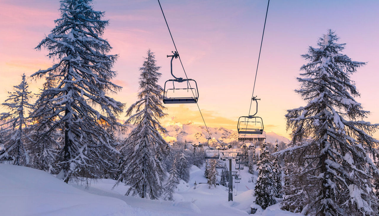 Winter mountains panorama with ski slopes and ski lifts