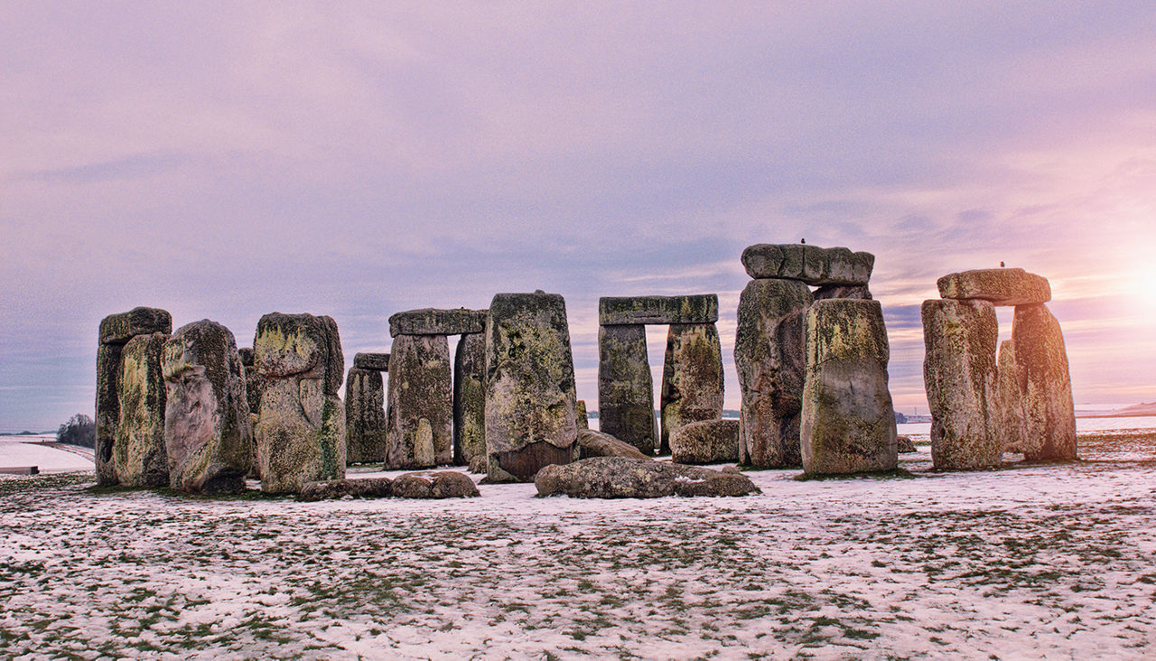 HDR image of the rocks on stonehenge in England in the snow.  Fine grain added.