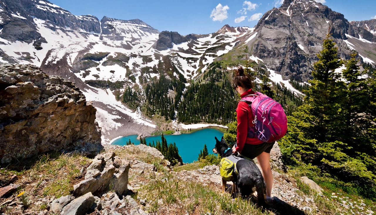 Young Woman Hiker and Dog