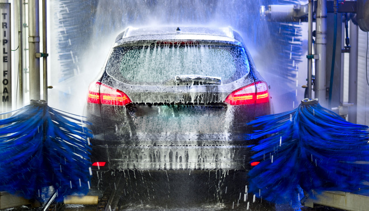 Car going through an auto car wash 