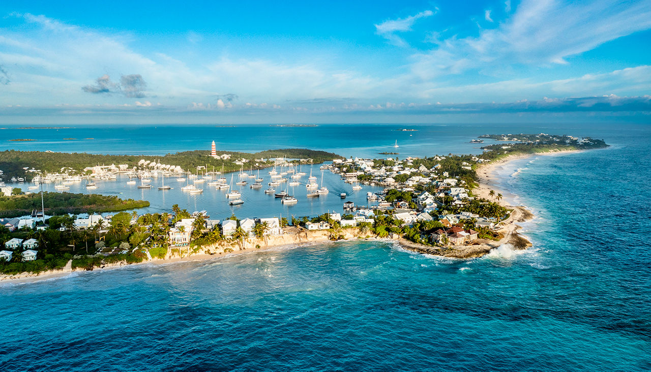 Drone view of harbor bay with many yacht on mooring balls, blue sky and  waters