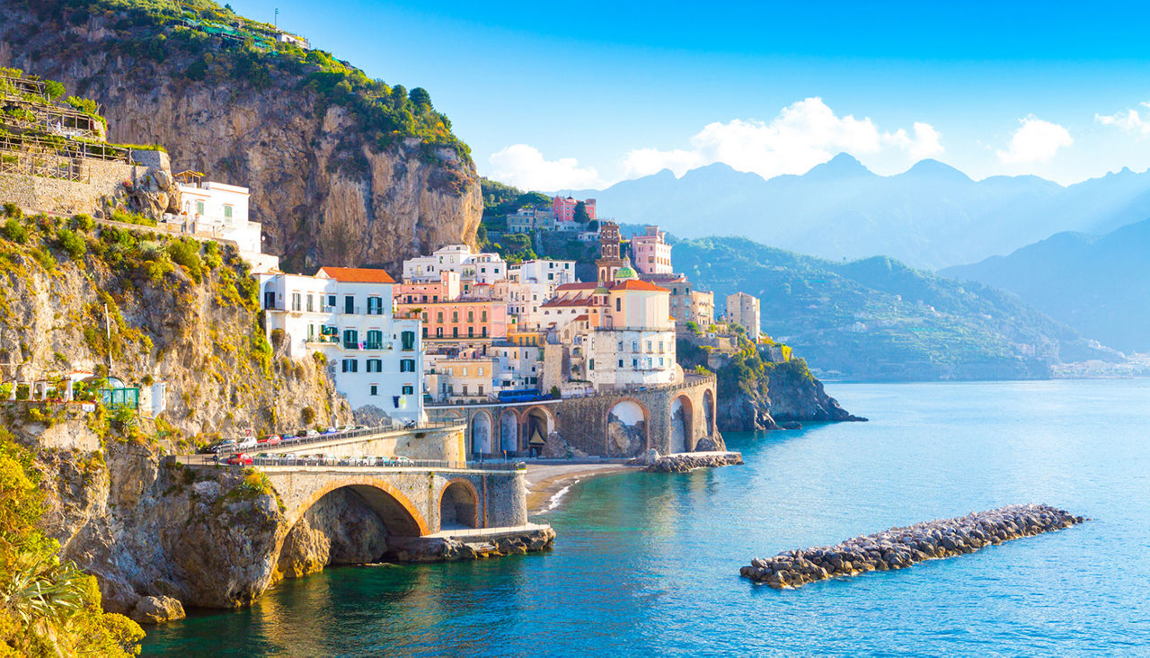 Morning view of Amalfi cityscape on coast line of mediterranean sea, Italy