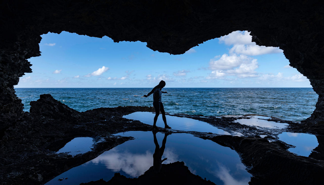 Explorer at Animal Flower Cave at North Point, Barbados