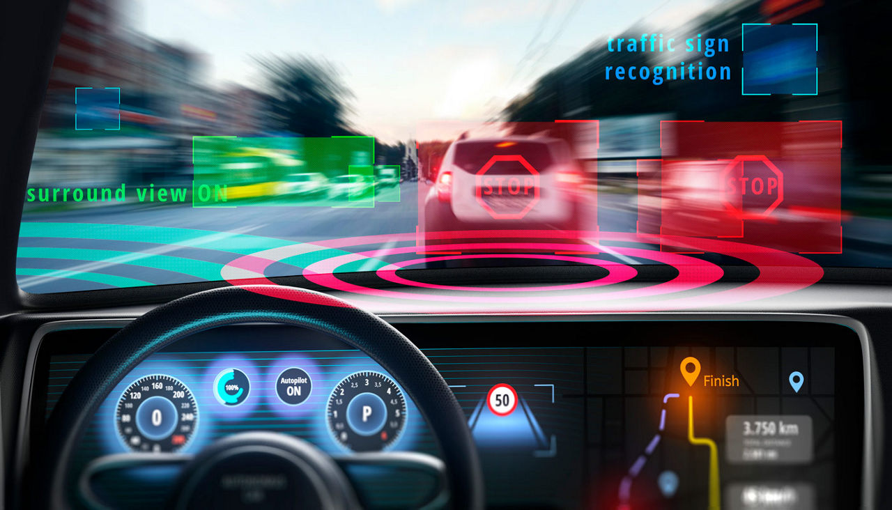 A graphic showing in-car technology that shows how it can recognize road signs.