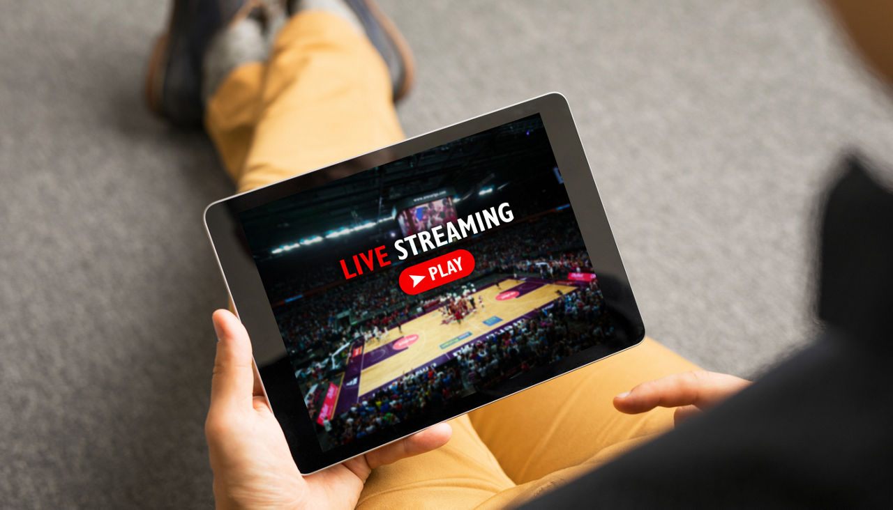 Man watching sports on live streaming online service