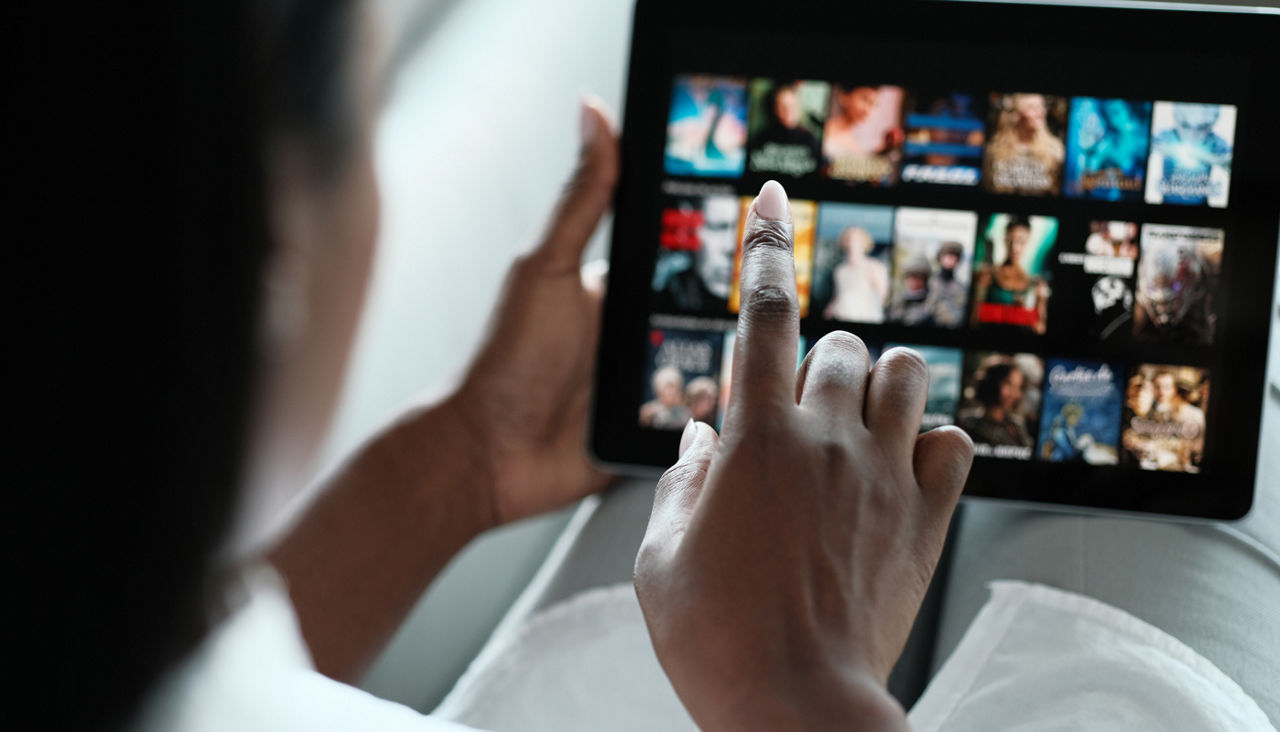 Black Woman Browsing Movie On Streaming Media Service