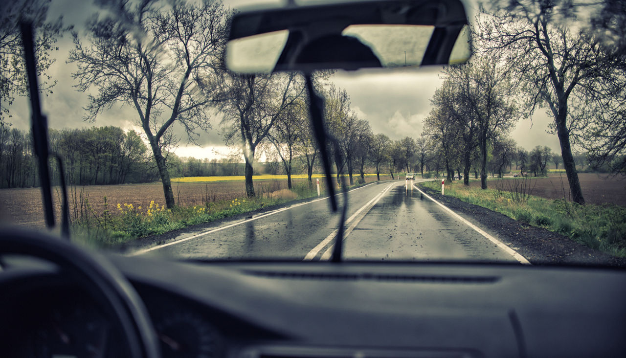 Driving along the road on a rainy day