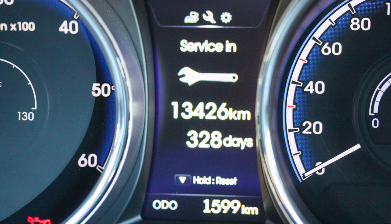 Vehicle with digital service indicator on dashboard