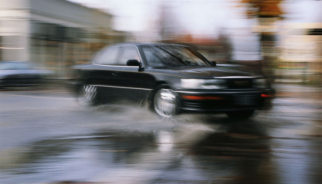 Car driving on wet road