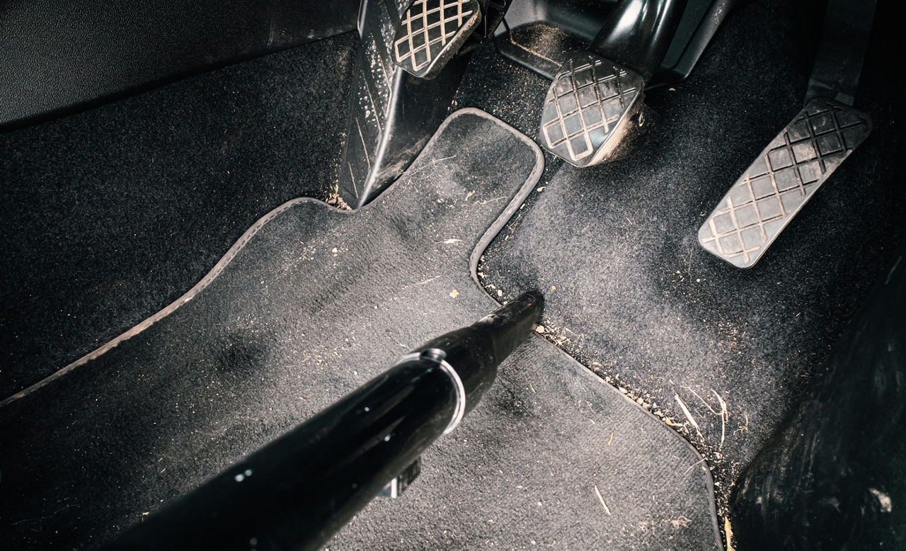 Vacuuming dirty car interior