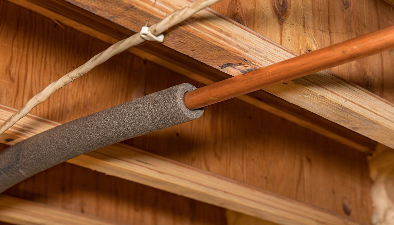 Water pipe with insulation in house crawlspace