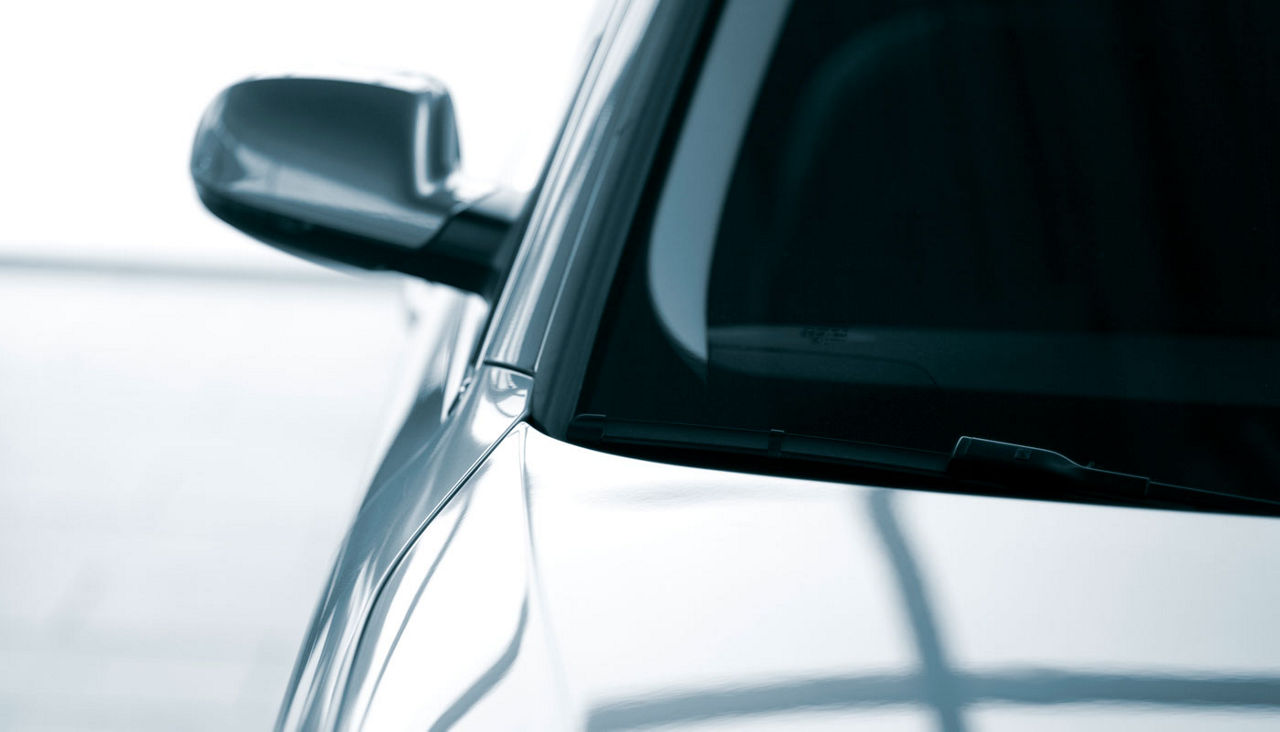 front view of sedan car with dark tinted windows