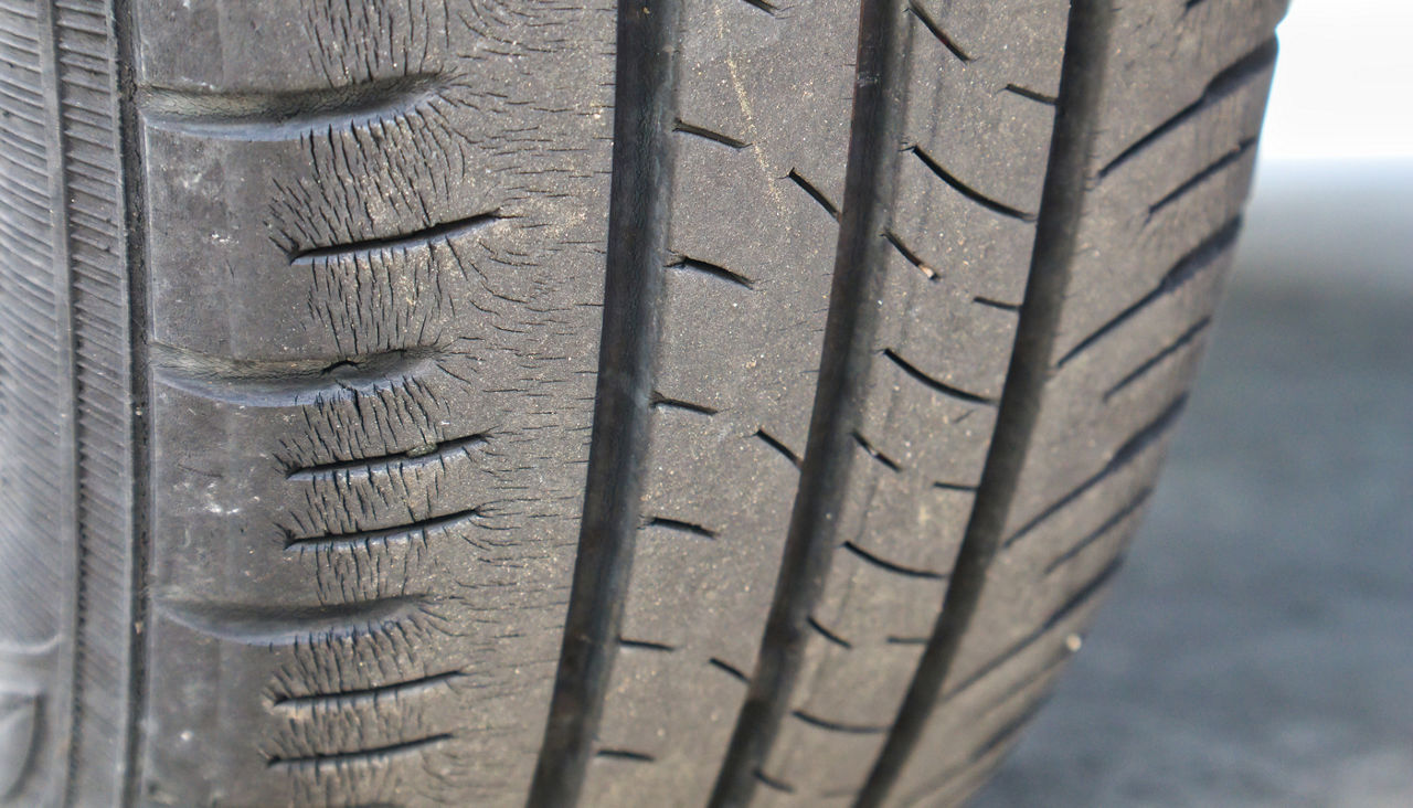 Tire with consider wear and cracks 