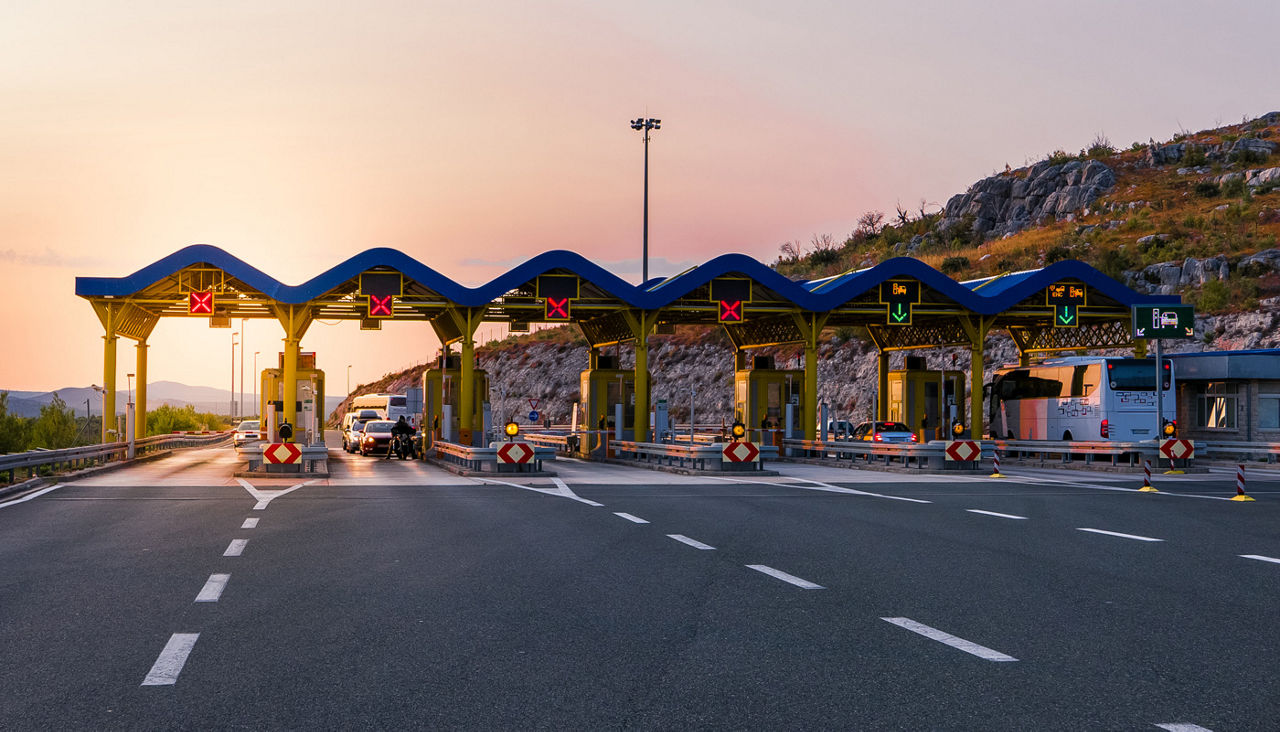 Cars passing through the toll gate on the highway