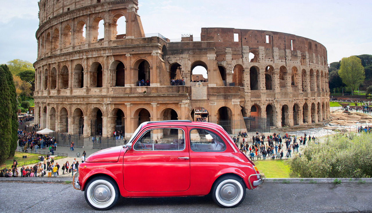 Italy Rome, Colosseum, with red old small car foreground