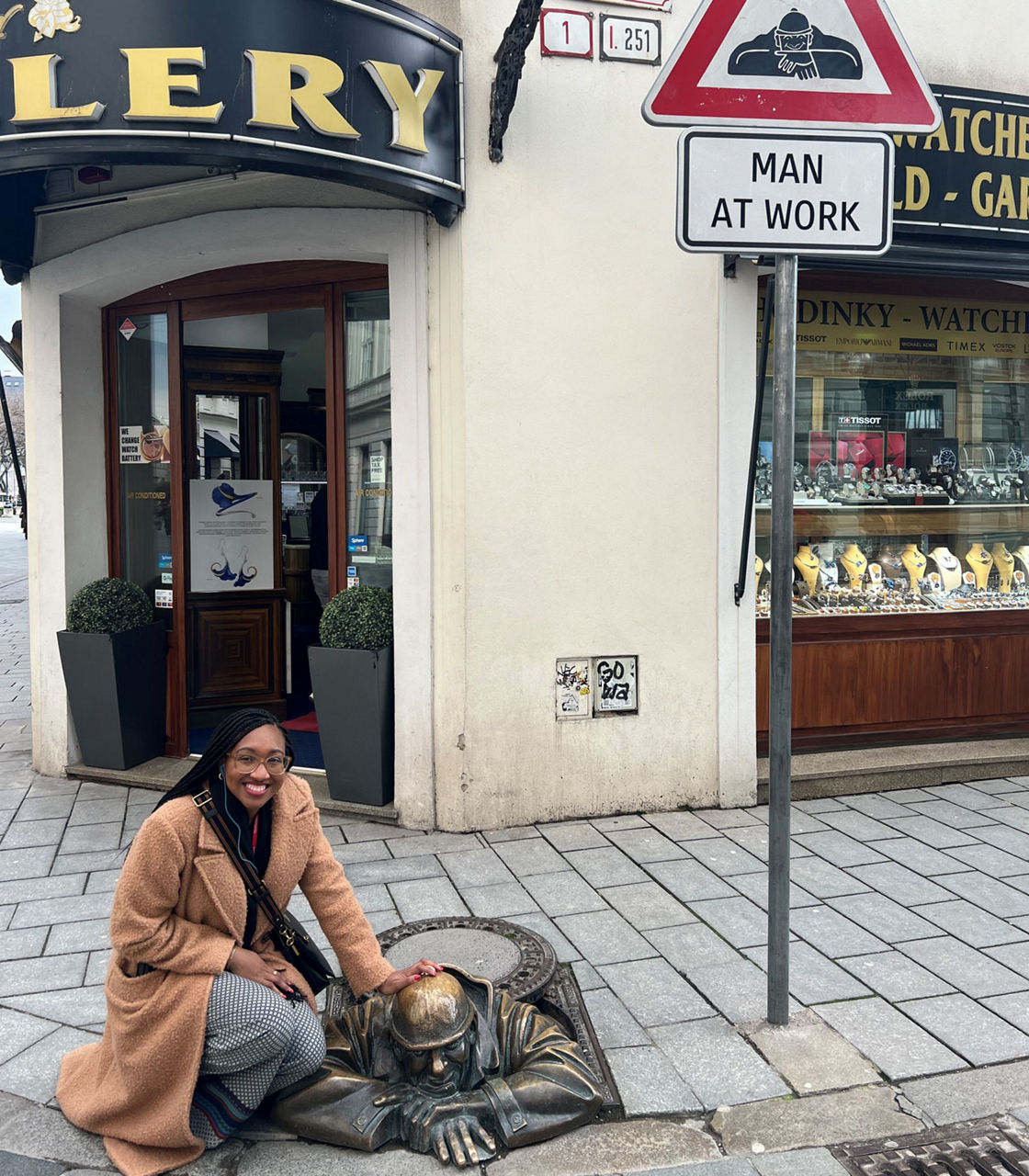 Jasmin posing with Man at Work bronze statue