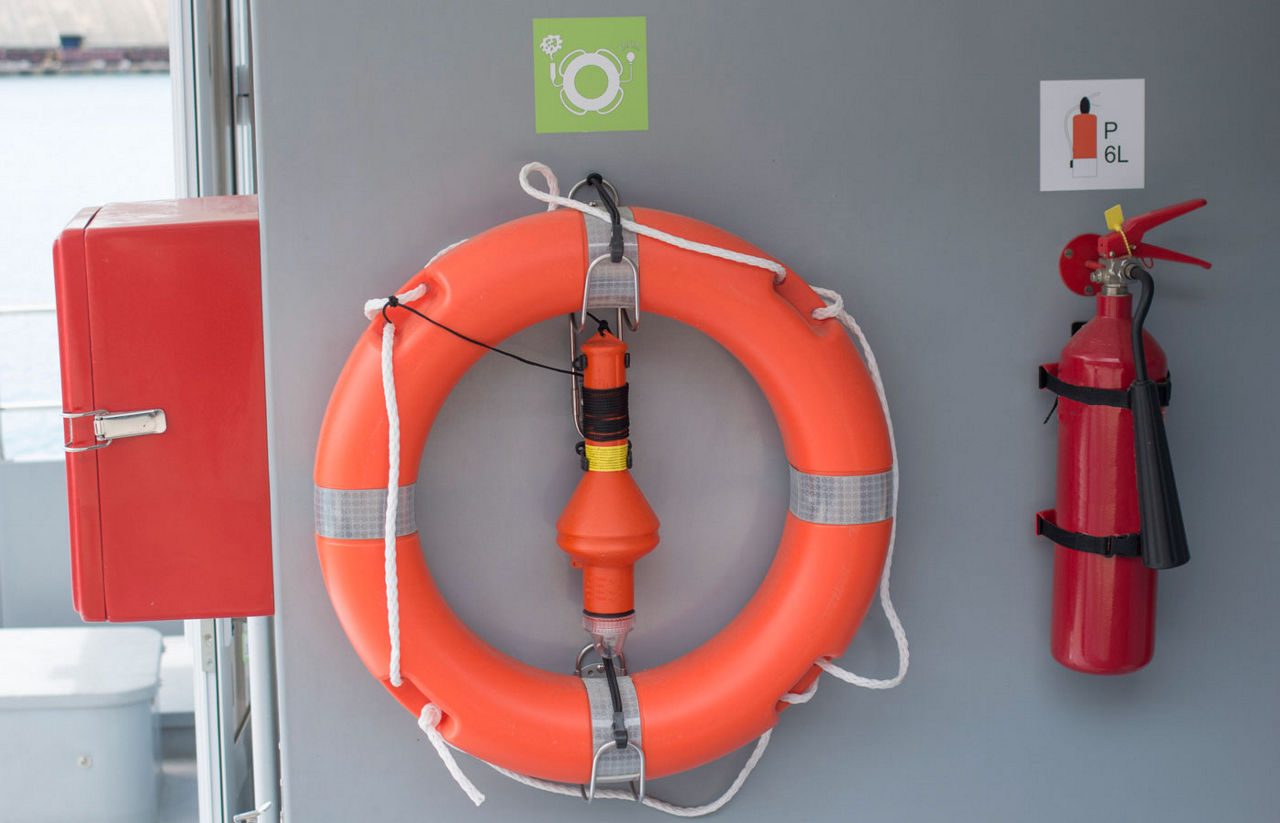 Boat safety equipment including fire extinguisher