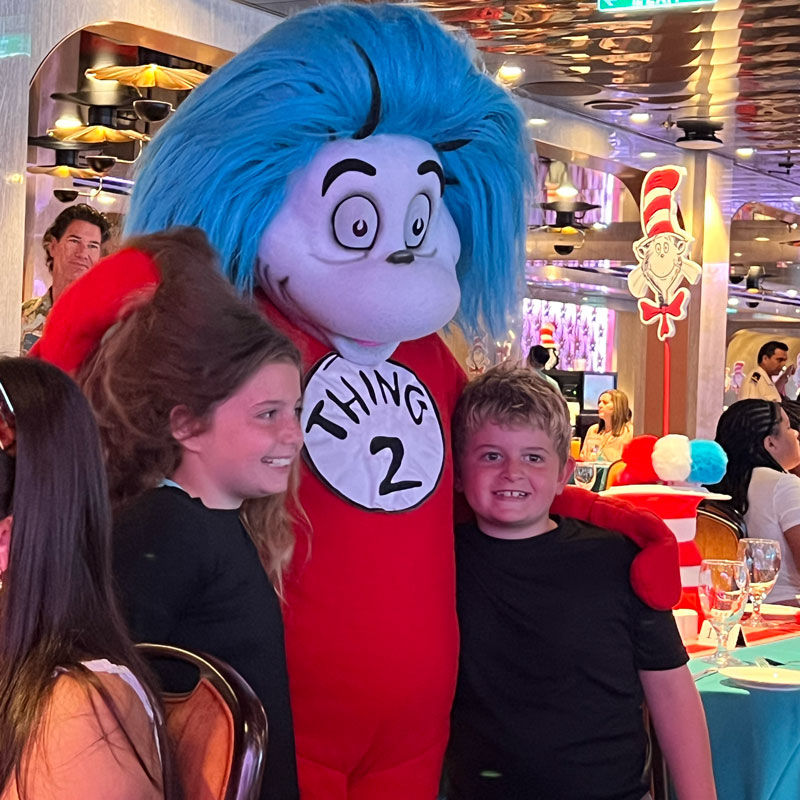 Children posing with Seuss' Thing 2 onboard Carnival Jubilee