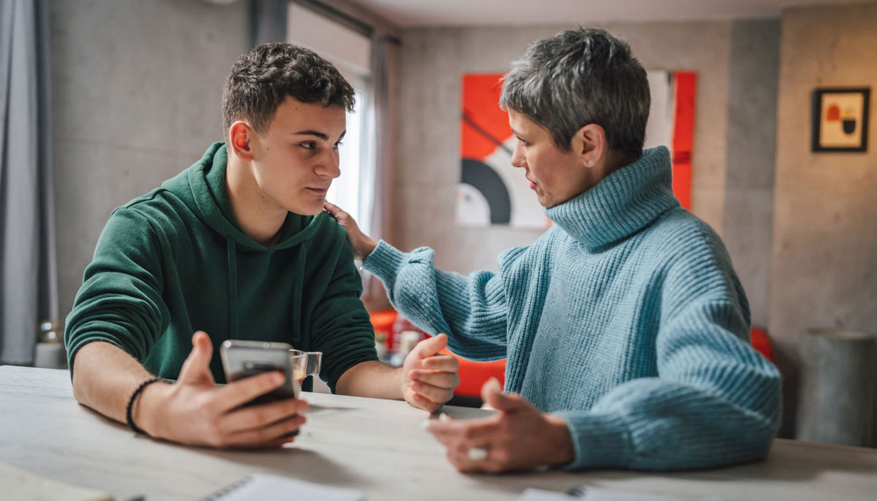 Mother and son talking about getting his first car as a teen