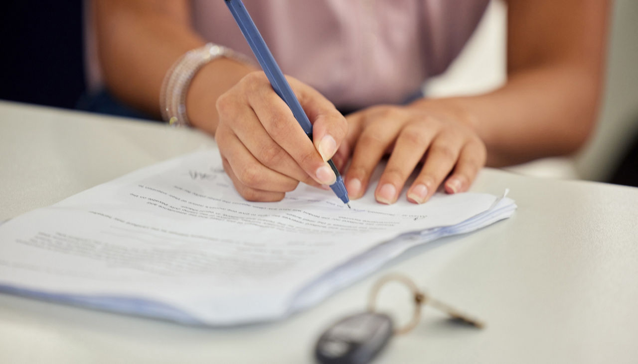 Vehicle, key and hands of person to sign legal finance paperwork for loan offer and commitment