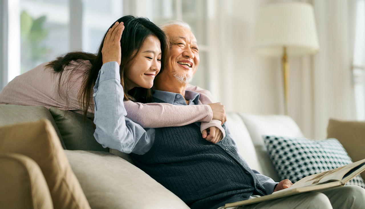 asian elderly father and adult daughter having a good time