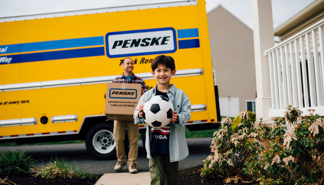 Penske moving truck with father and son 