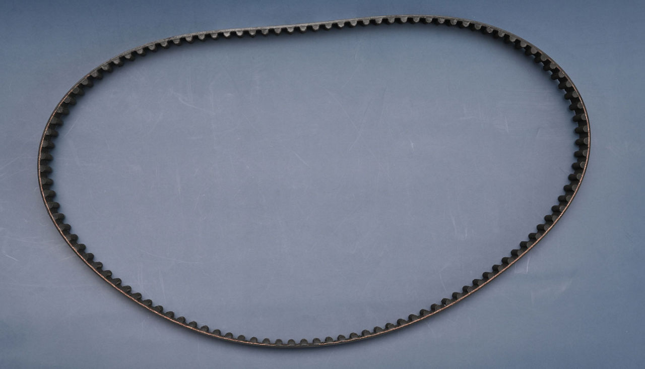 Timing belt on a blue background close-up