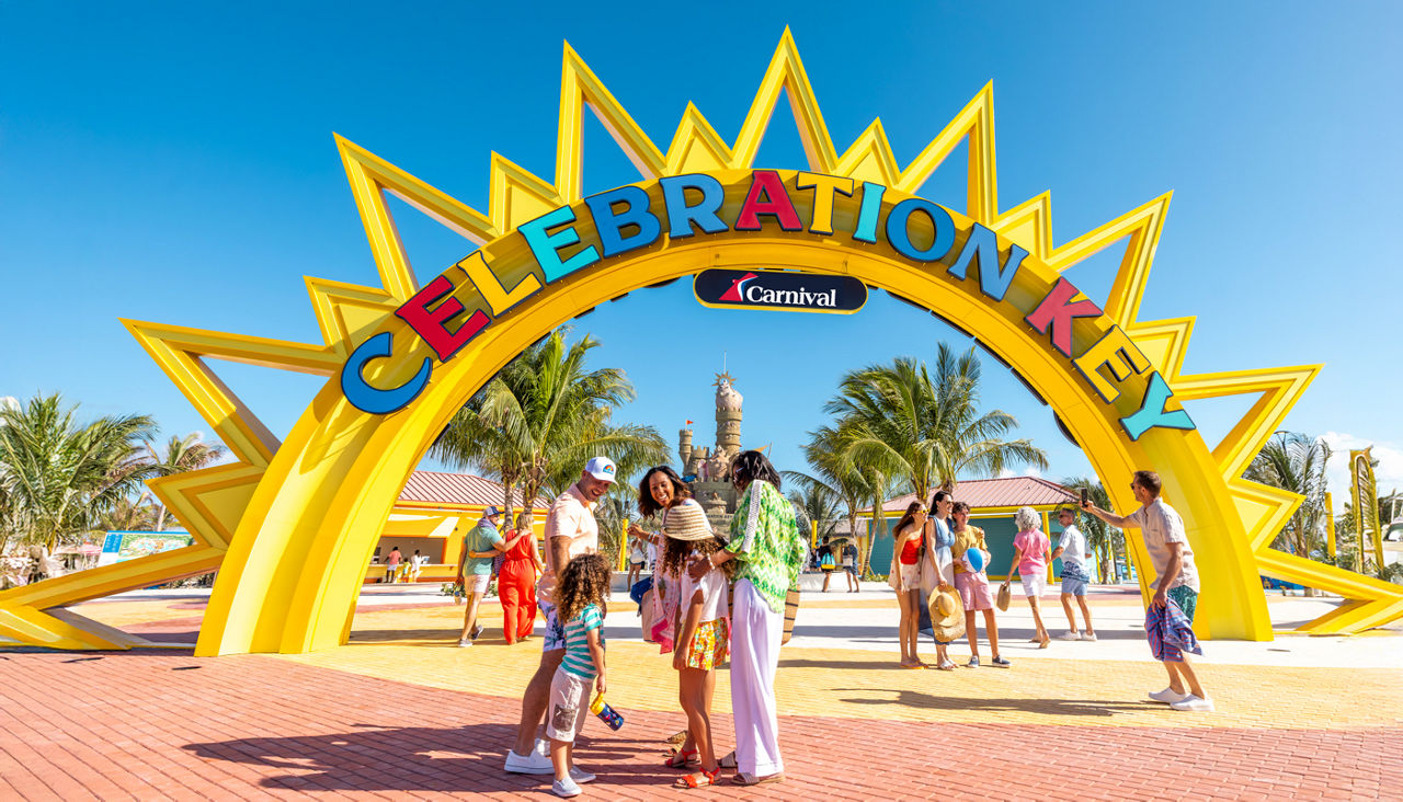 Family at Celebration Key entrance arch