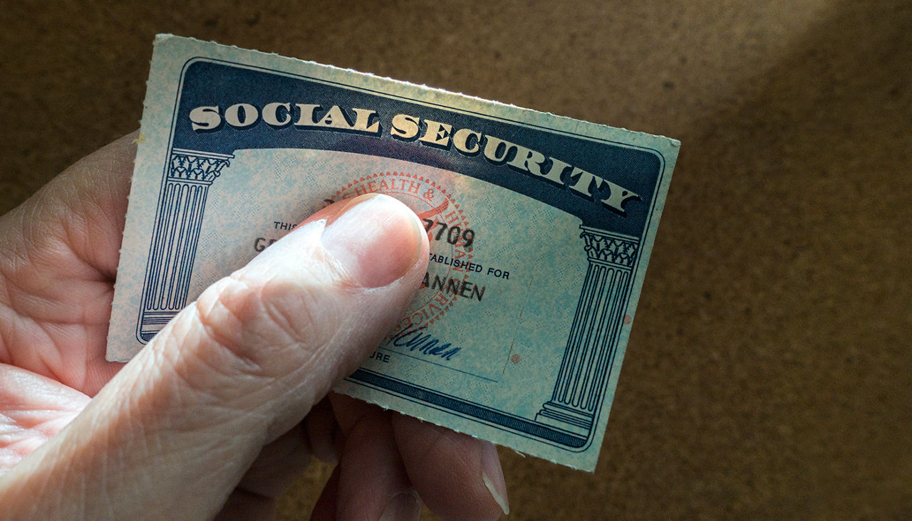 Hand holding a social security card