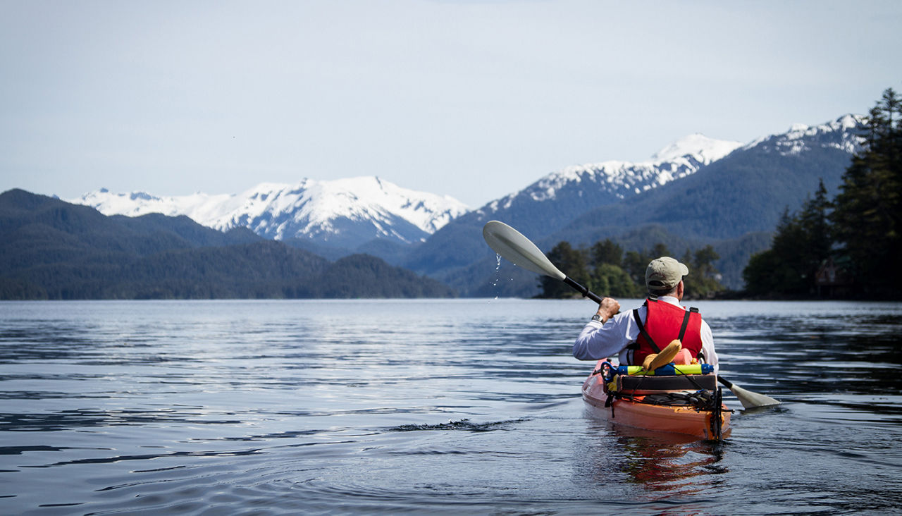 Man kayaking in Sitka Harbor, Alaska