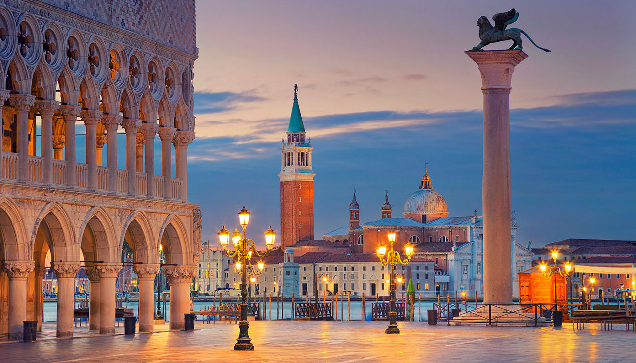 A dusk view of Venice near a canal. 