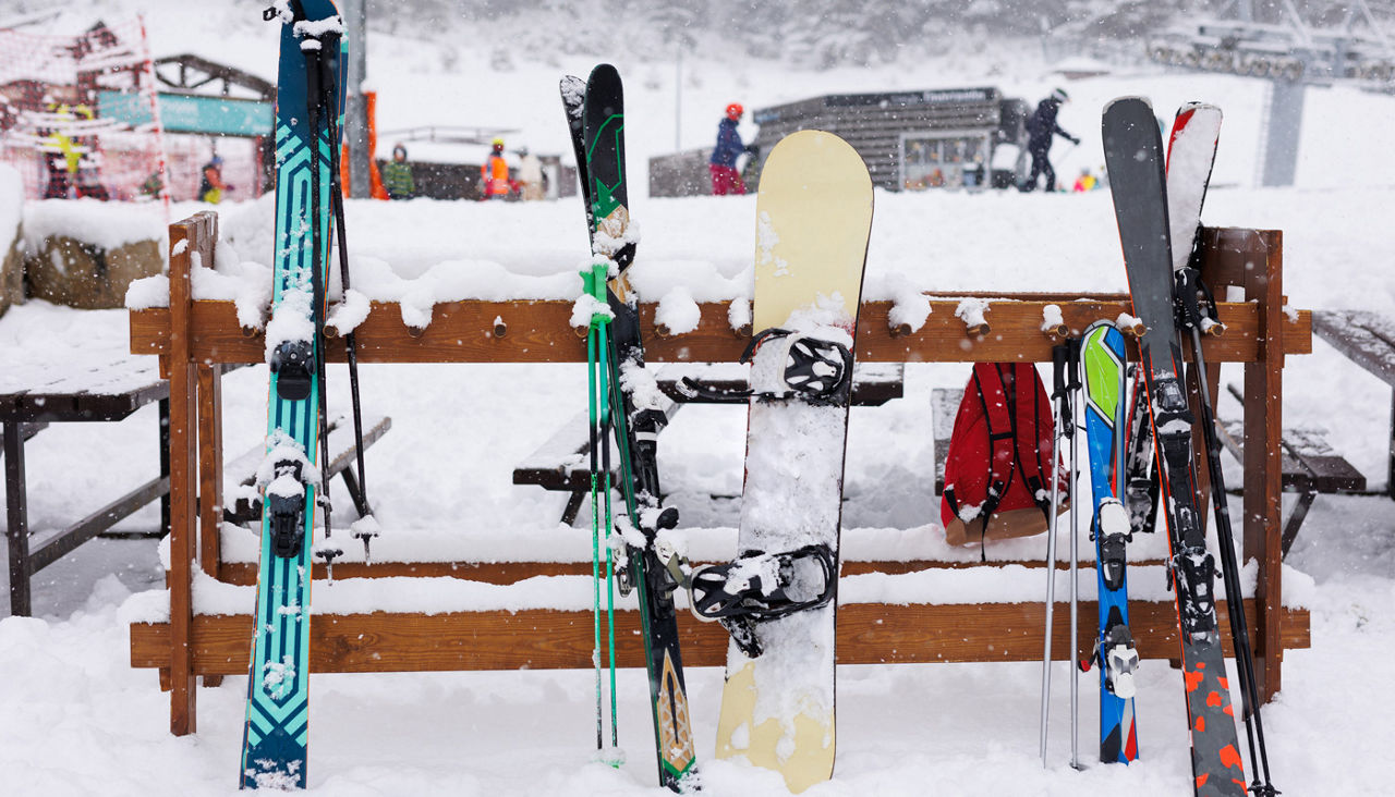 Active winter holidays, woman skiing downhill in sunny day.