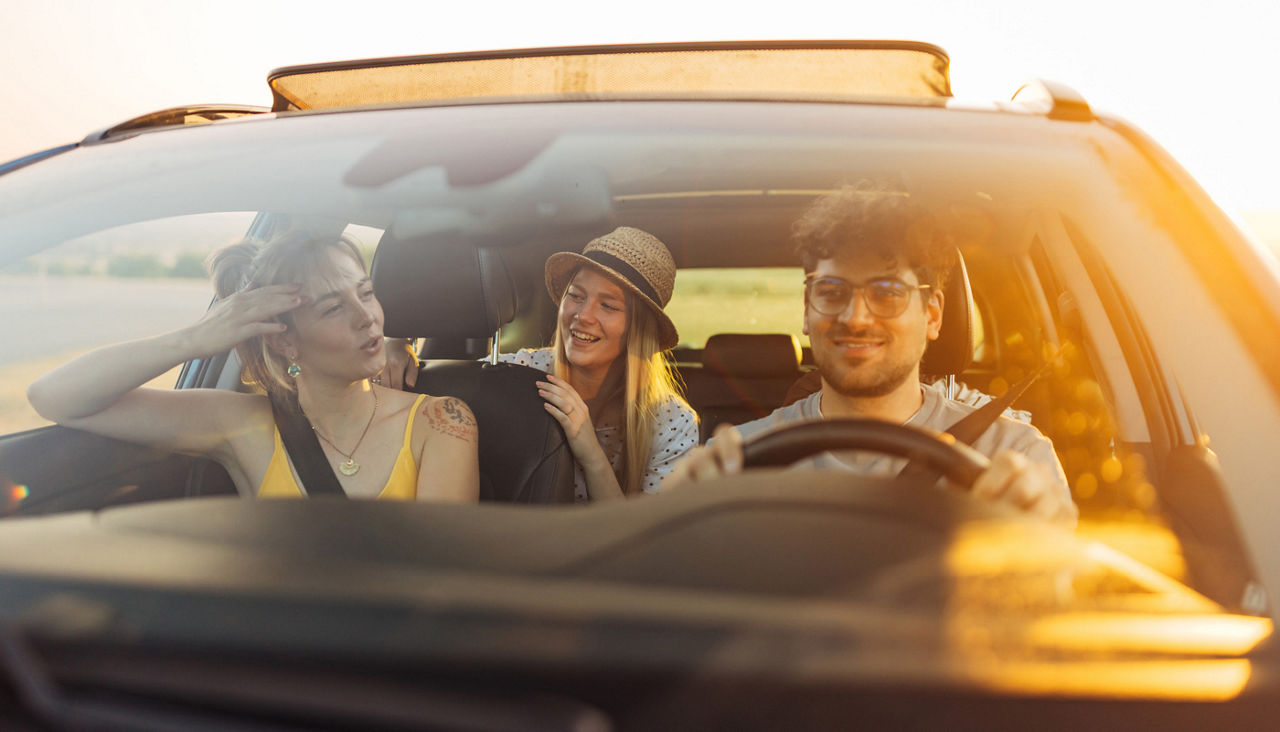 Group of friends driving together to a sports game