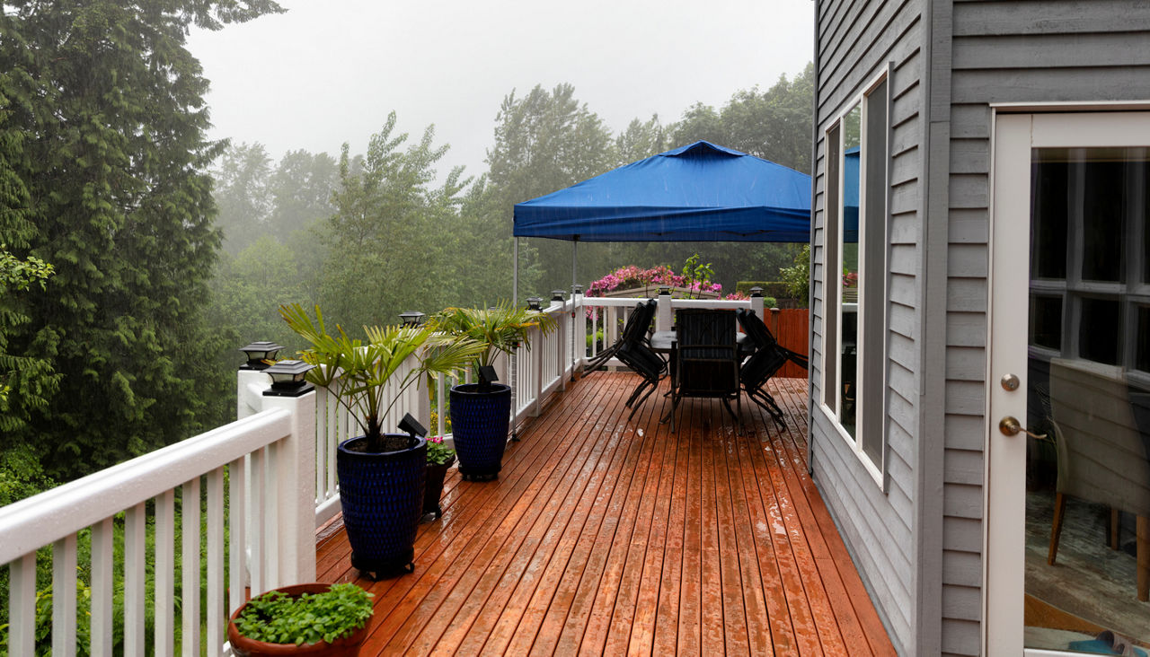 Heavy rain storm cancels home outdoor deck party 