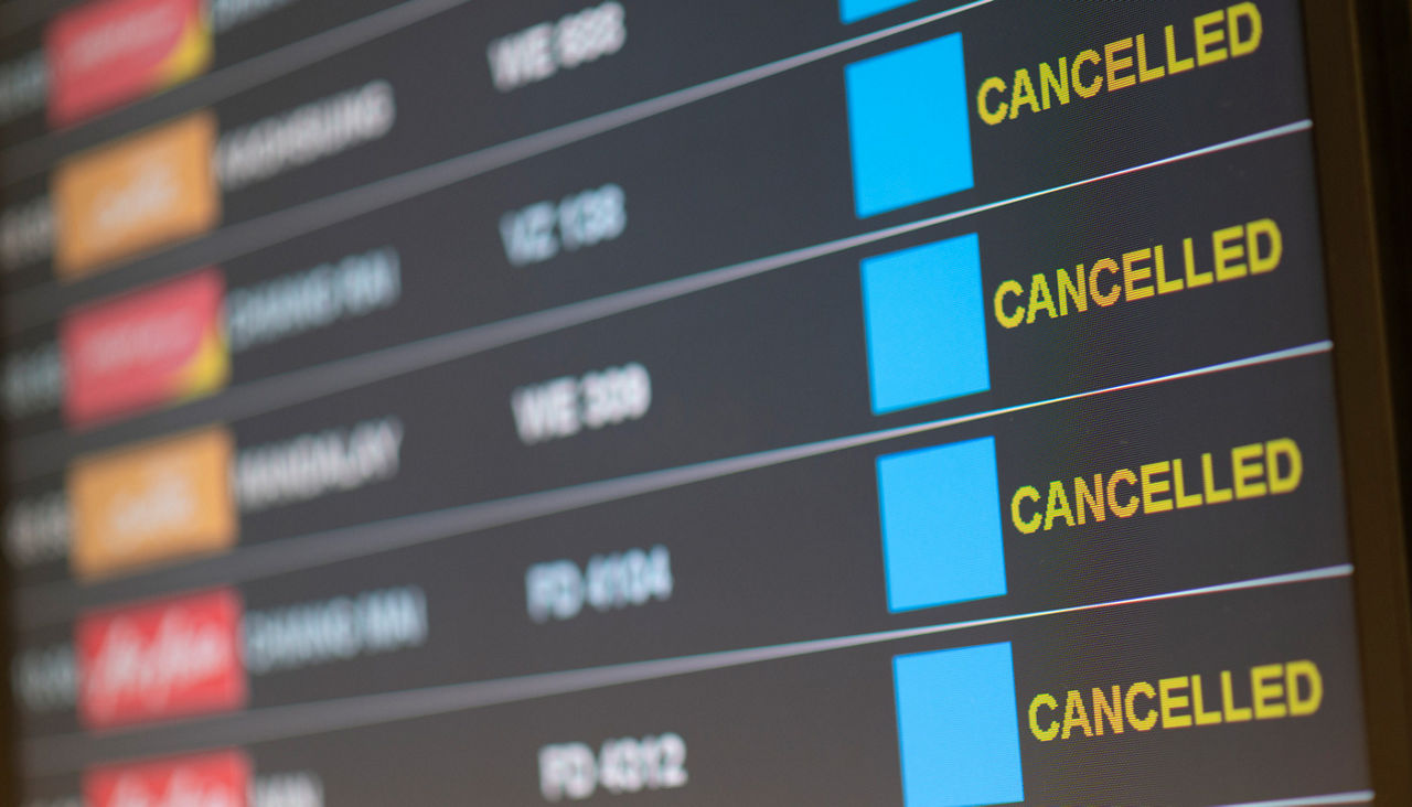 Departure flight board with cancelation at the Airport