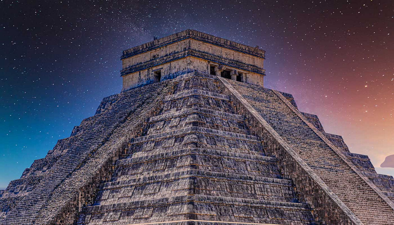 Temple Pyramid of Kukulcan El Castillo, Chichen Itza, Yucatan, Mexico, Maya civilization with Milky Way Galaxy stars night sky