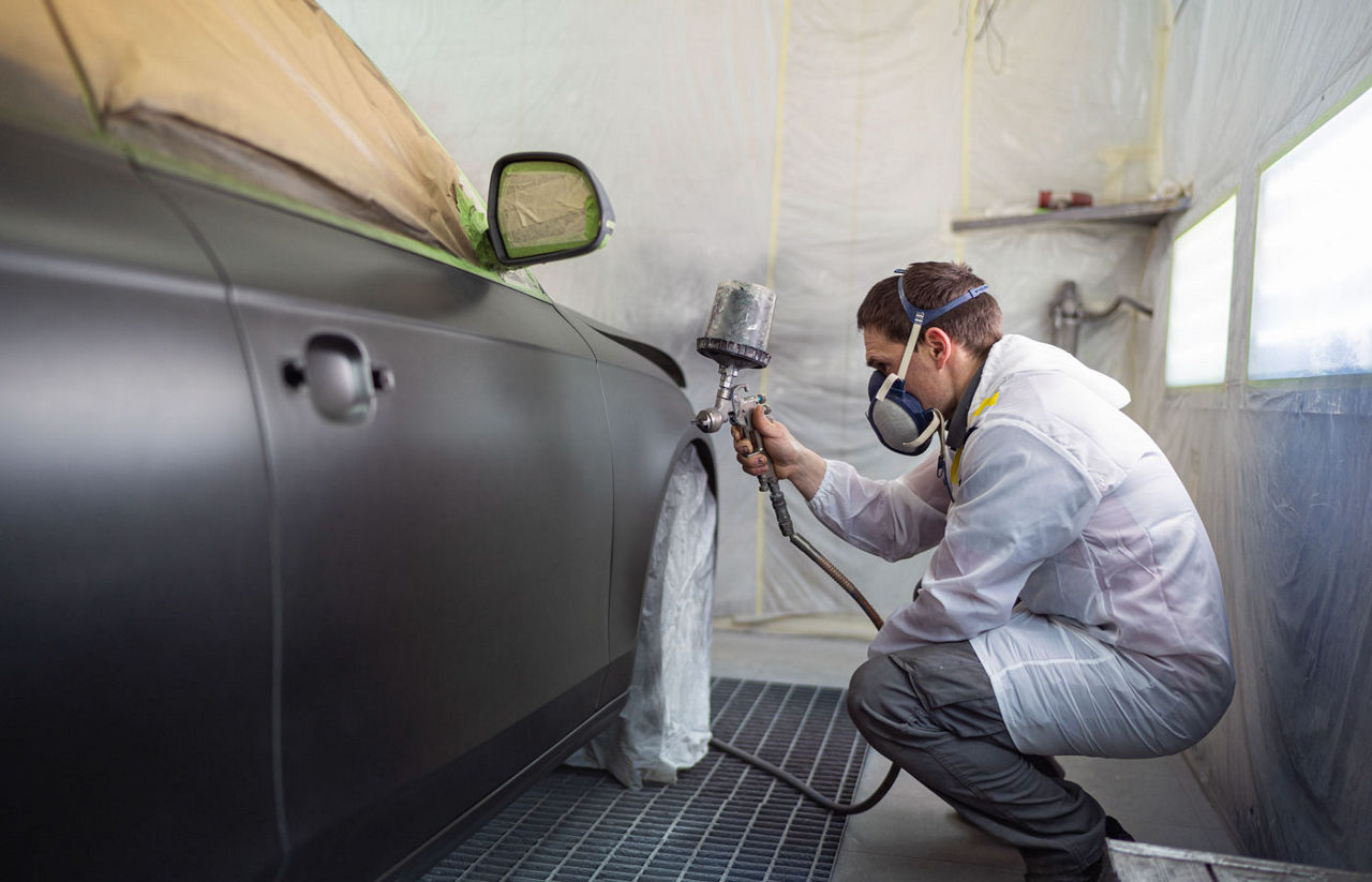 car being painted in a bay