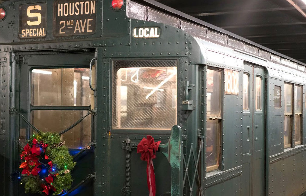 NYC’s Holiday Nostalgia Trains are rolling, with vintage 1930s subway cars decked out in holiday cheer