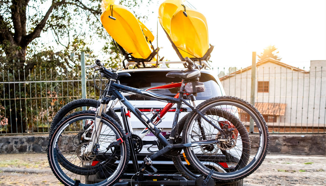 Vehicle with kayaks and bikes loaded securely