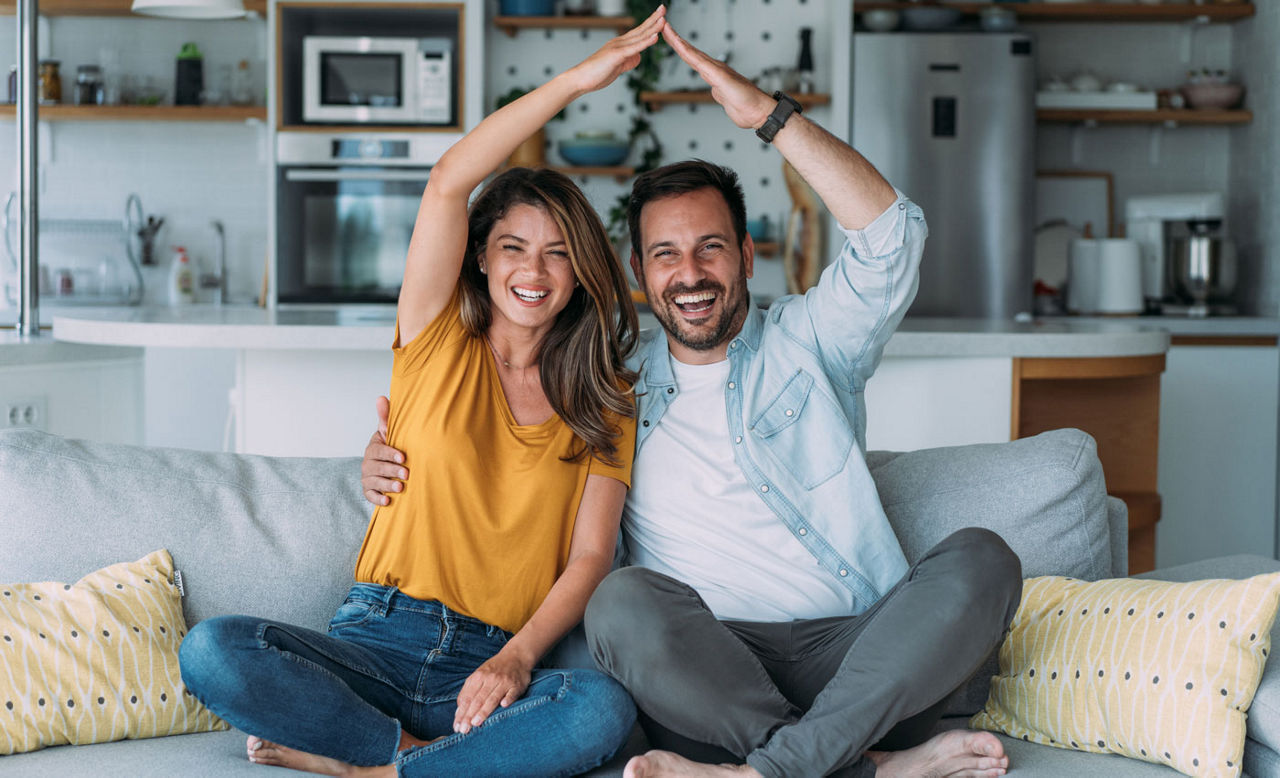 happy couple in new home