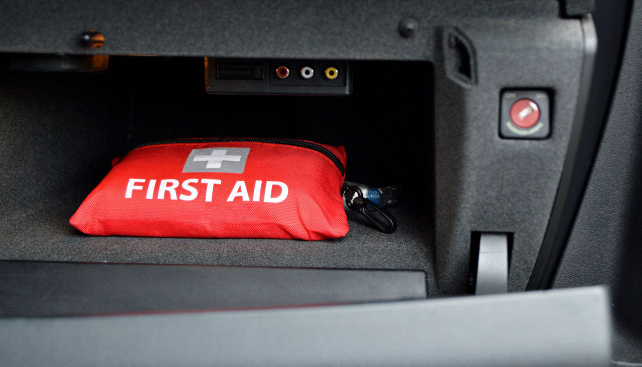 First aid kit in glove box of car