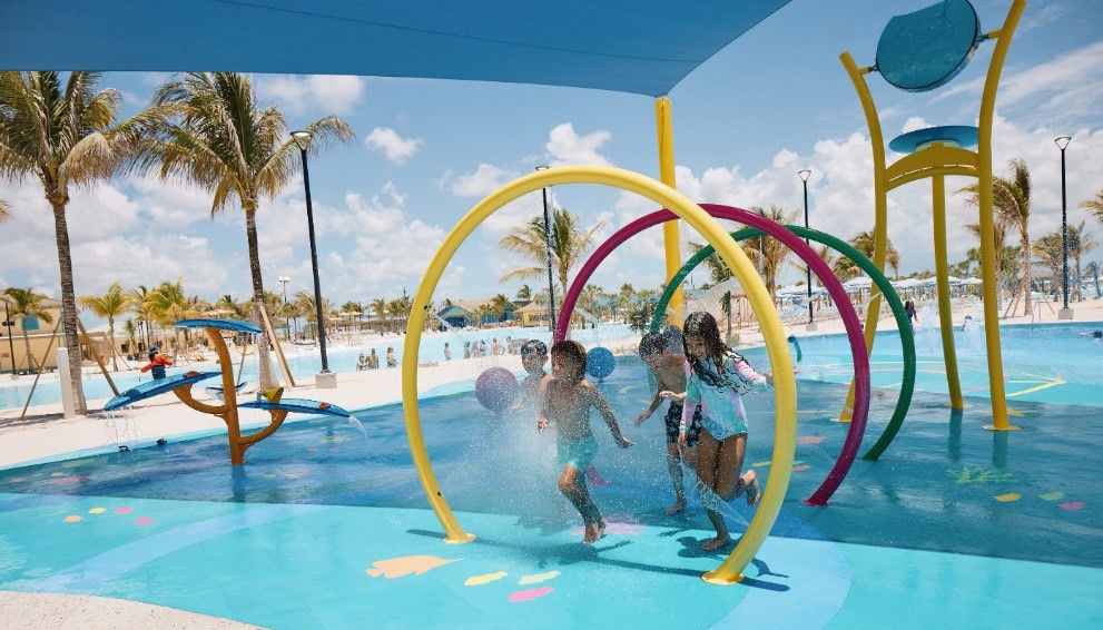 Children playing in colorful water park on Celebration Key