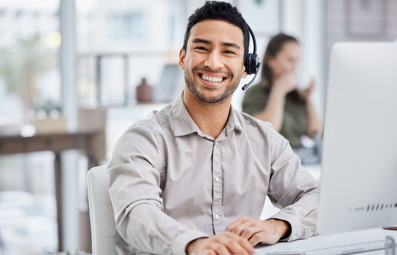 Customer service, portrait of male call center agent with headset