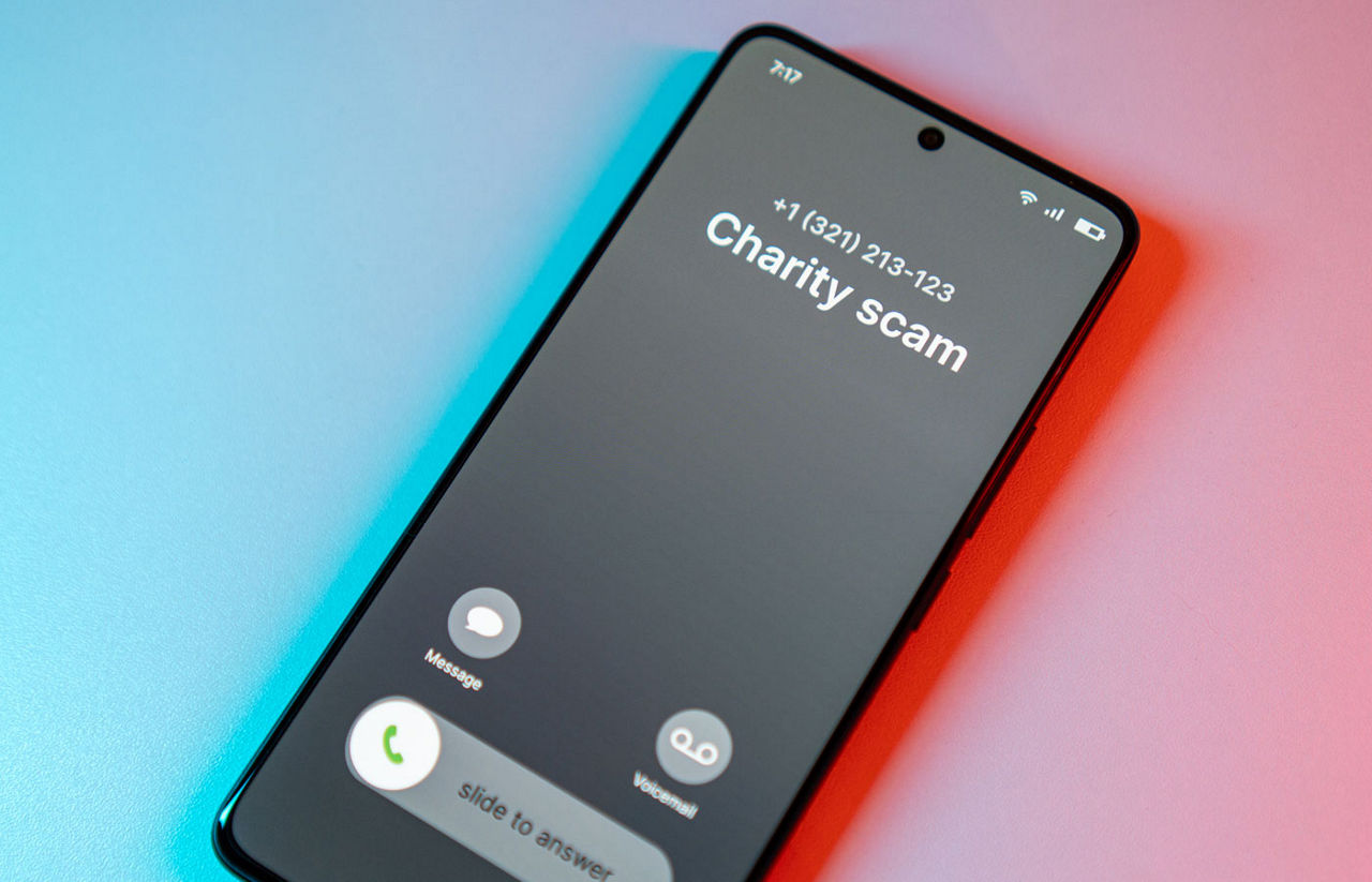 Charity Scam call concept on mobile phone