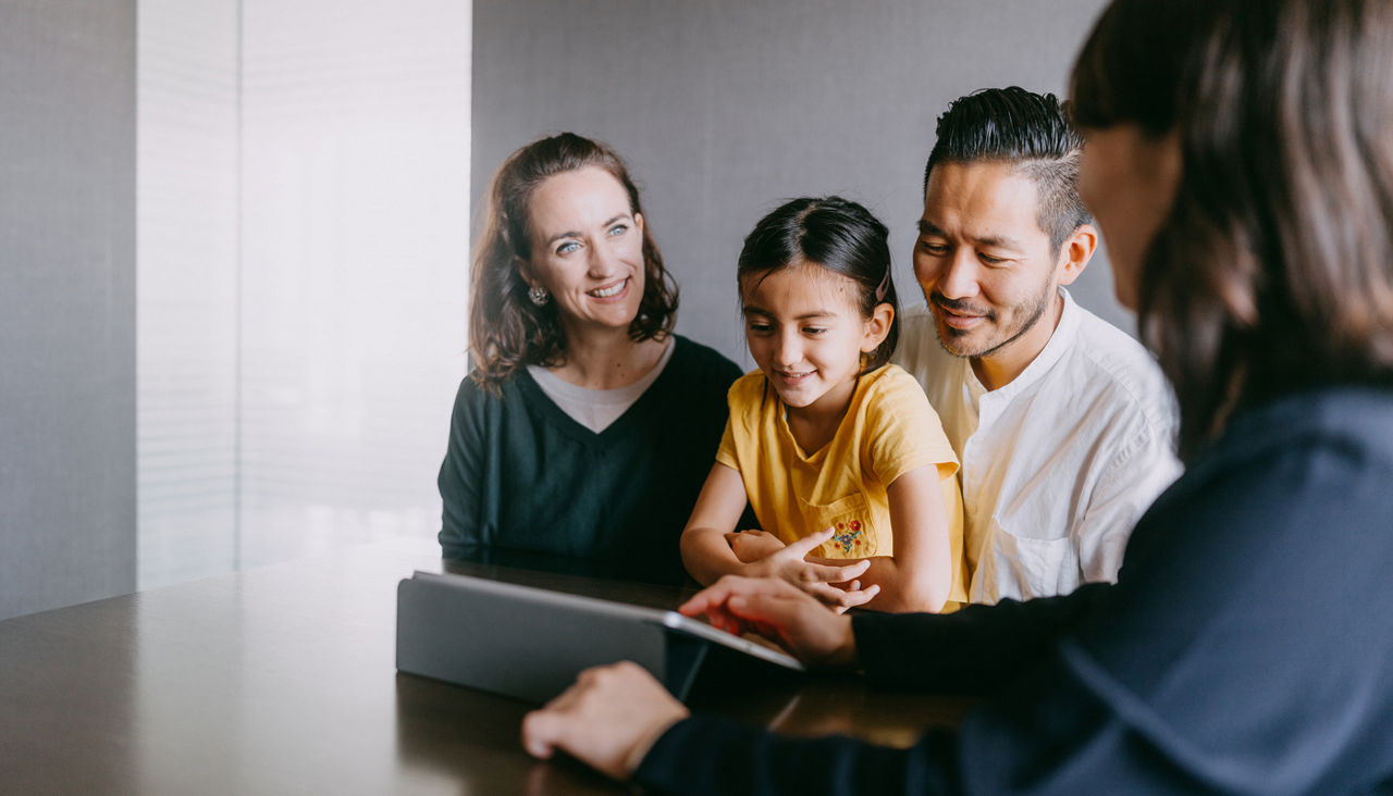 Family consulting with insurance agent