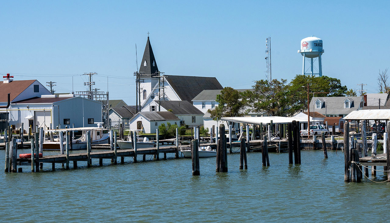 Ferry docks, Tangier Island, Virginia, USA, supports a small tourist industry. The island is expected to subside into Chesapeake Bay around 2050 due to geologic factors and rising sea levels.