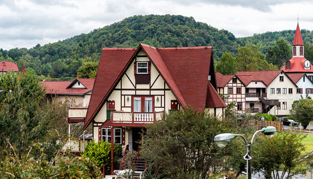 Red roofed buildings of German architecture with mountains in background